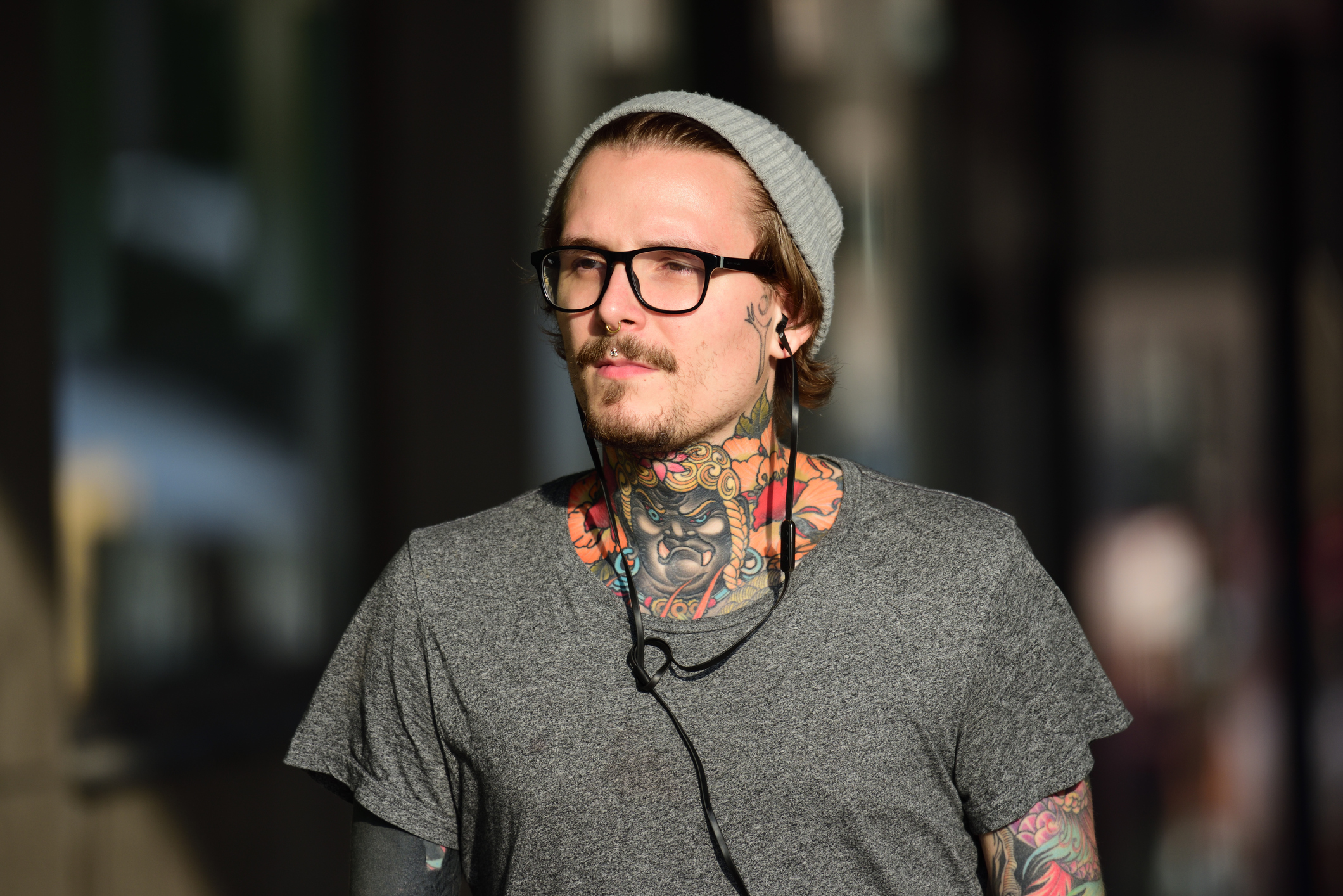 Cool Man With Tattoos, Hat And Headphones